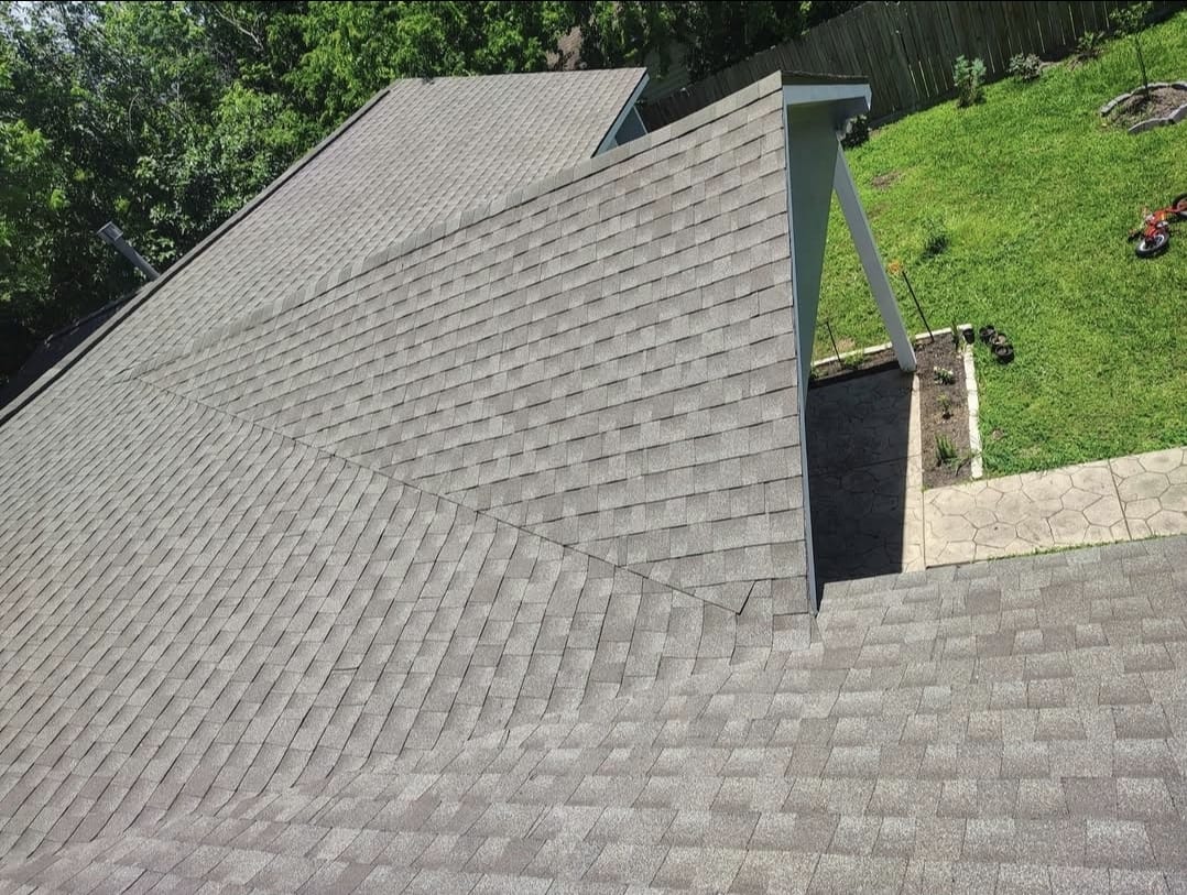 After: completed shingle roof replacement on a Houston, TX home